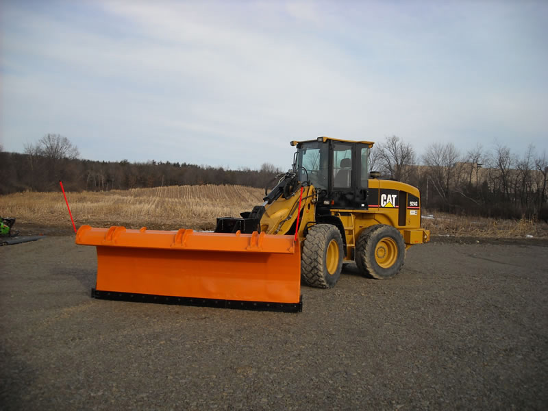 CAT loader with snow plow attachment