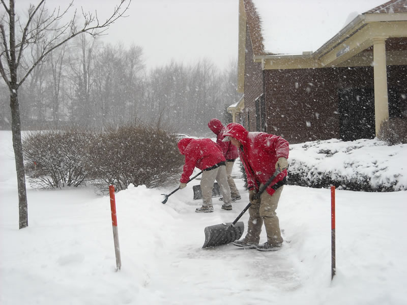 Team clearing walkways during storm